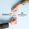 TaskForce and Windana merger - Light blue background with two hands, one from up and one from below, fitting two puzzle pieces together. On the left is TaskForce logo, on the right is Windana logo