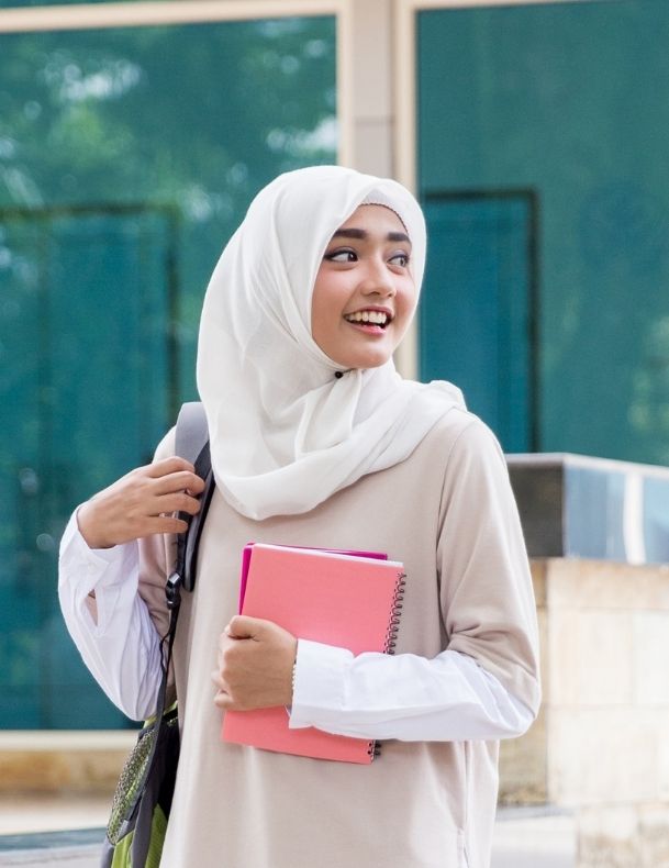 Image of muslim young women carrying handbag and notebooks. Featured image TaskForce's short courses